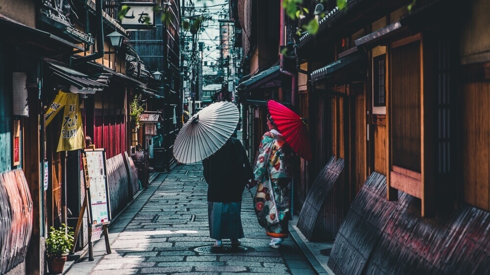 A couple walk at gion in kyoto