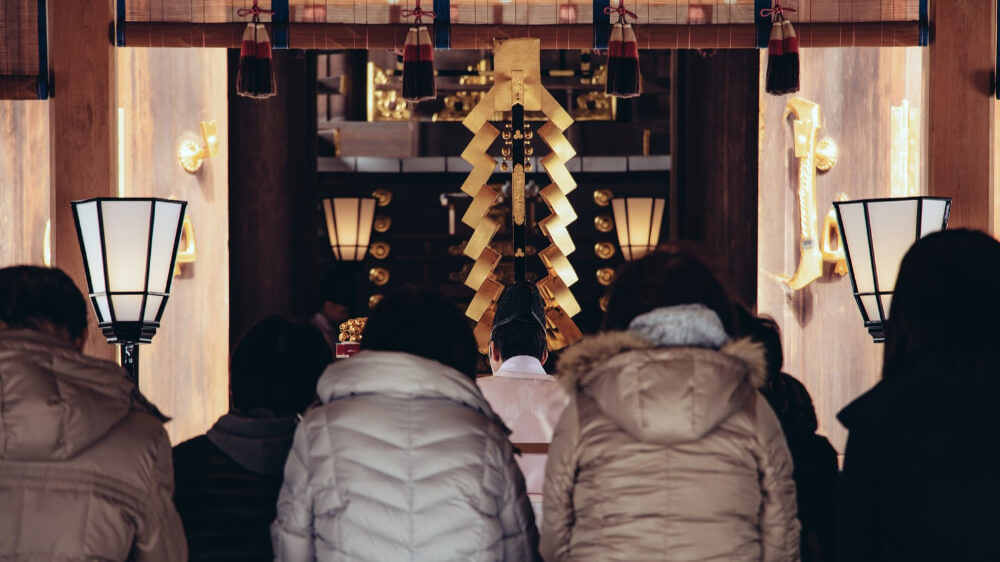 people visiting a shrine