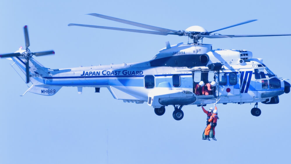 a man rescued by a helicopter