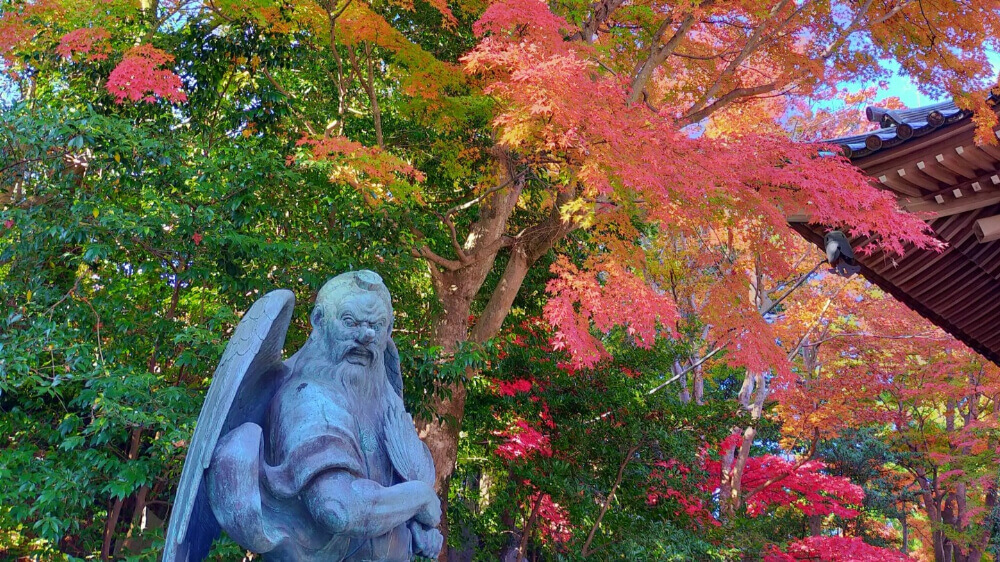 autumn leaves, temple and a statue at Mt.takao, Tokyo