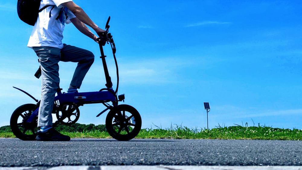 a man travelling by share bike